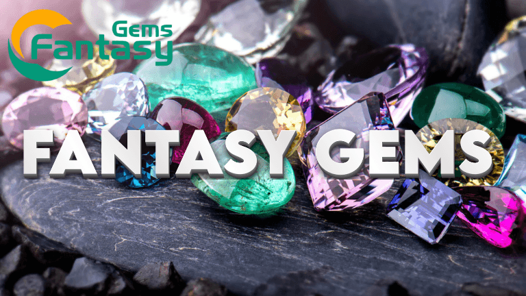 Sparkling fantasy gemstones arranged on a smooth black surface